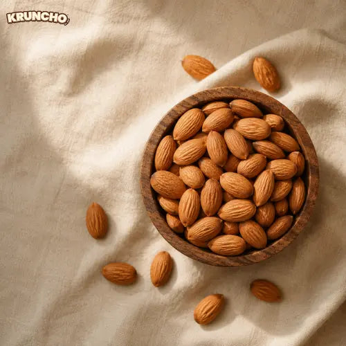 Whole raw almonds in a wooden bowl, healthy snack photography.