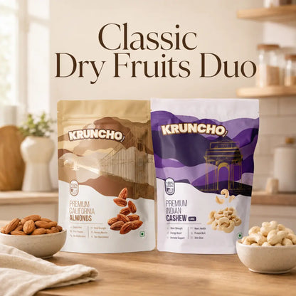 Kruncho "Classic Dry Fruits Duo" featuring pouches of Premium California Almonds and Premium Indian Cashews with bowls of nuts in a bright kitchen setting.