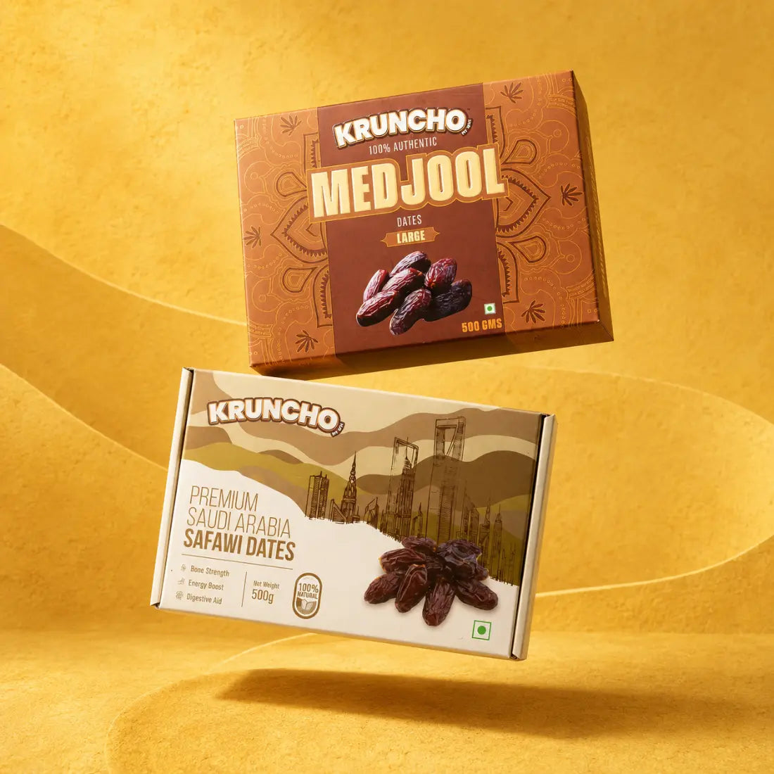 Two boxes of Kruncho brand dates, featuring Large Medjool dates and Premium Saudi Arabia Safawi dates.