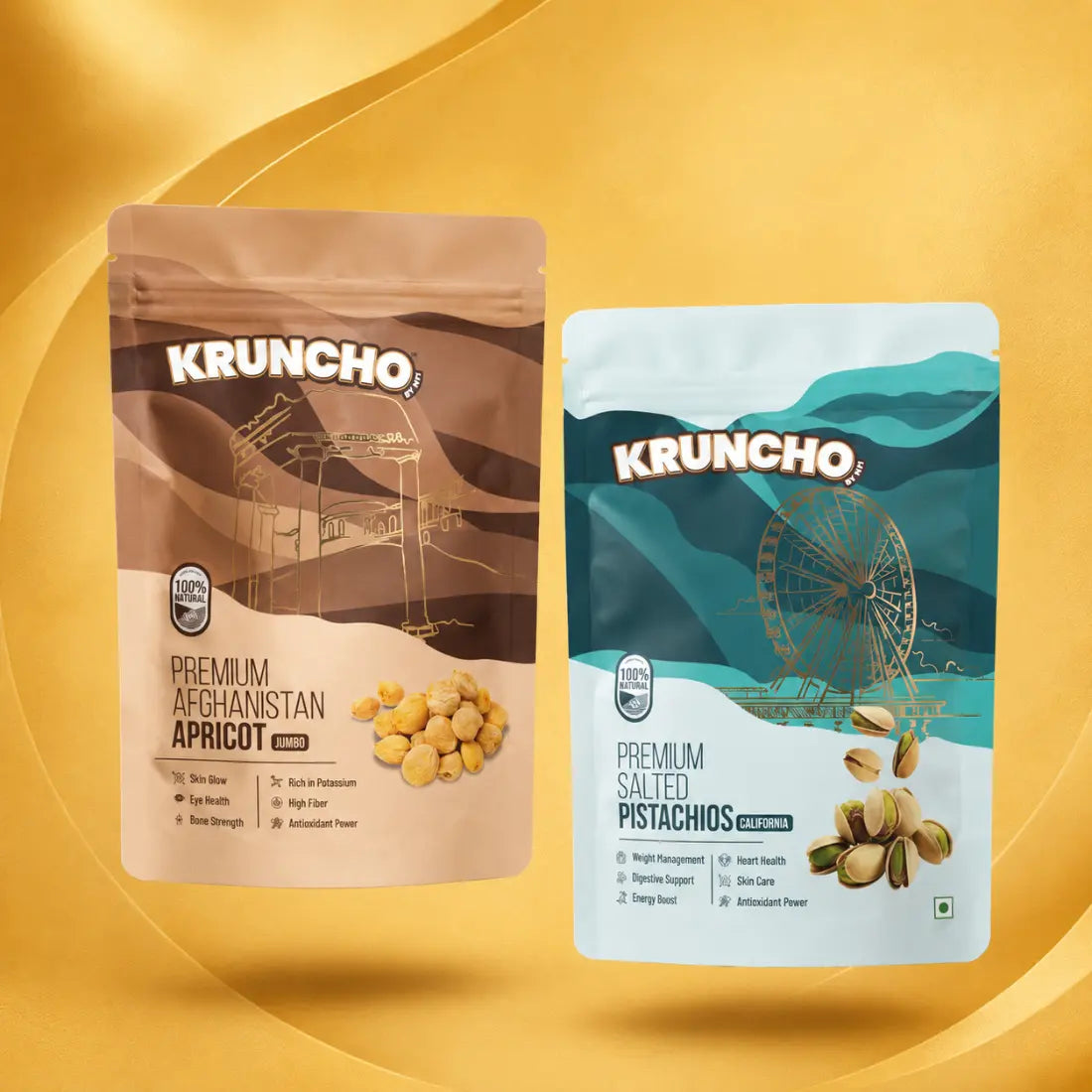 Two standing pouches of Kruncho healthy snacks: Premium Afghanistan Apricot Jumbo and Premium Salted Pistachios California against a gold background
