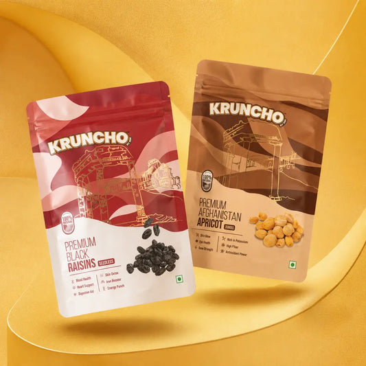 Kruncho Premium Black Raisins and Premium Afghanistan Apricot product packaging pouches on a yellow background.