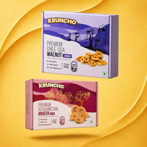 Two 250g Kruncho brand boxes featuring Premium Chile USA Jumbo Walnuts and Premium Afghanistan Jumbo Anjeer on a yellow background.