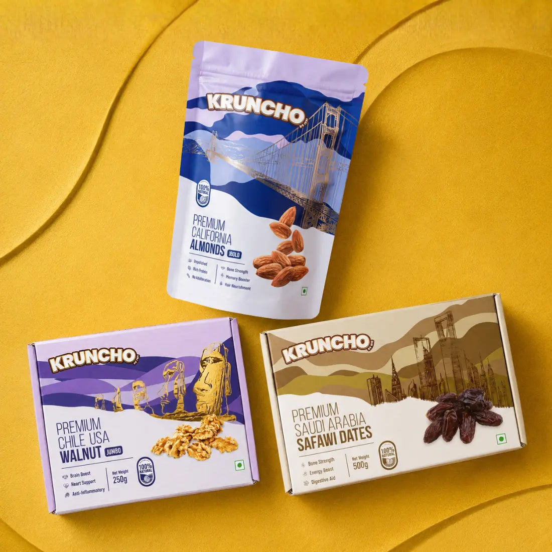 A flat lay of Kruncho premium packaged healthy snacks, including California almonds, walnuts, and Safawi dates.