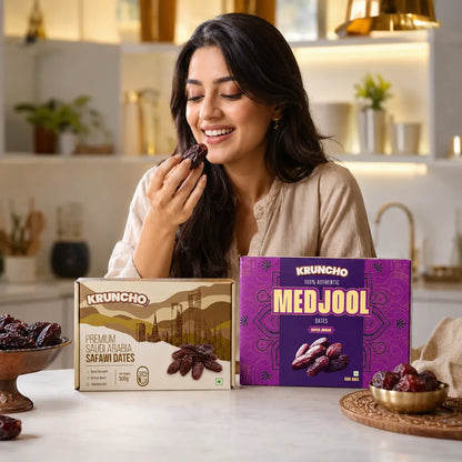 Luxury Dates Duo display featuring Kruncho Safawi and Medjool Dates 500g boxes alongside loose dates in elegant golden bowls.
